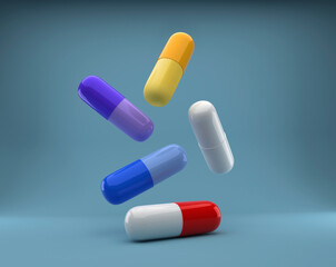 A group of antibiotic capsules falls. Health care and medicine