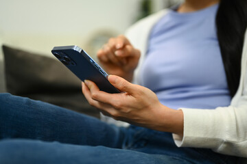 Relaxed young woman texting messaging, communication in social media on mobile phone