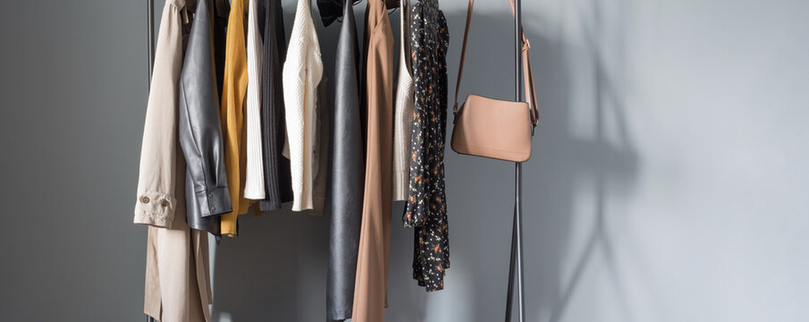 basic women's autumn wardrobe with shoes and handbags on  hanger