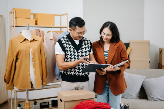 Diverse female fashion designers at work with tailor centimeters on necks and holds tablet and smartphone. independent creative design business. .