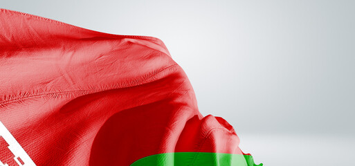Belarus national flag cloth fabric waving on beautiful sky Background.