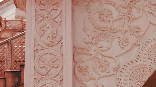 artistic hand carved red stone jain temple at morning from unique angle video is taken at Shri Digamber Jain Gyanoday Tirth Kshetra, Nareli Jain Mandir, Ajmer, Rajasthan, India.
