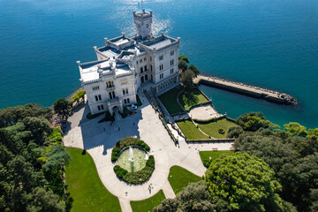 An aerial of the Miramare Castle in the scenic Gulf of Trieste in Italy captured on a bright day