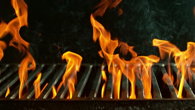 Super Slow Motion Shot of Cast Iron Grate with Fire Flames. Filmed on High Speed Cinematic Camera at 1000 FPS.