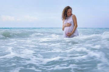Pregnant woman and sea