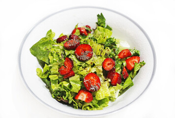 fresh salad with lettuce, strawberries and chia seeds - healthy diet concept