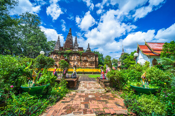 Fototapeta na wymiar Wat Chet Yot or Wat Photharam Maha Wihan, seven pagoda temple It is a major tourist attraction in Chiang Mai, Thailand.with evening,Temple in Chiang Mai.