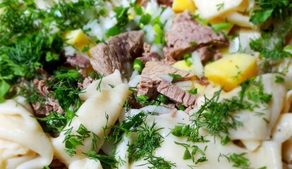 Turkish national dish of potatoes, meat, onions, spices, and dough - beshbarmak, or five fingers