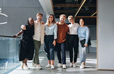 Portrait of a diverse business team standing together in an office