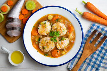 Hake stew with potatoes, leeks and other seasonal vegetables.