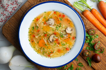 Vegetable soup with leeks, mushrooms, carrots, peppers and noodles.