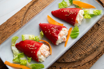 Piquillo peppers stuffed with mayonnaise and prawns. Traditional Spanish tapa.