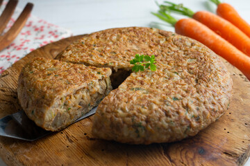 Spanish omelet made with rice and carrot. - obrazy, fototapety, plakaty