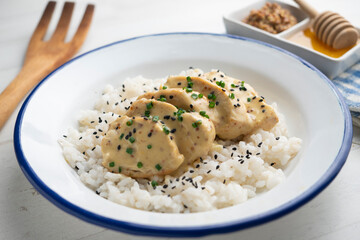 Chicken cooked with honey mustard sauce served over white rice.