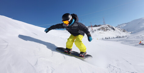 Fototapeta na wymiar snowboarder jumping in the mountains, kid snowboard tail turn slide position photo style hd wallpaper