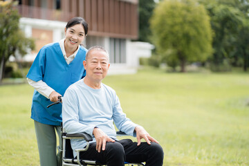 Elderly care concept. Portrait of nurse and her senior client on wheelchair.
