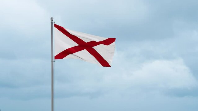 Alabama US state flag waving in the wind with cloudy sky, endless seamless loop