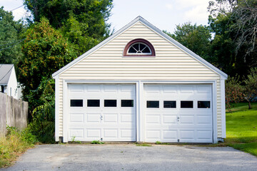 Fototapeta na wymiar Two Car Garage build as a single house with doors and windows