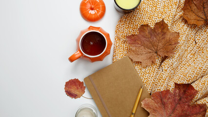 Concept of creating comfort in fall. Attributes of autumn time of spending hot tea in...