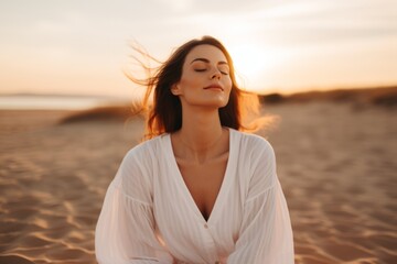 Portrait gorgeous charming relaxed European woman lady girl female sitting performing meditation beach sand ocean sea. Vacation trip mental health care happy traveler holiday soul rest wellness yoga - Powered by Adobe