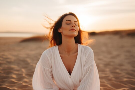 Portrait gorgeous charming relaxed European woman lady girl female sitting performing meditation beach sand ocean sea. Vacation trip mental health care happy traveler holiday soul rest wellness yoga