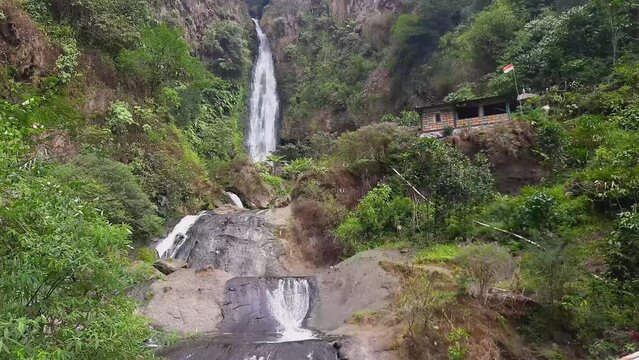 Curug Bajing Waterfall seen from a distance