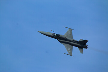 Fototapeta na wymiar F5 fighter flying in the sky