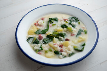 Rice soup with potatoes and spinach.