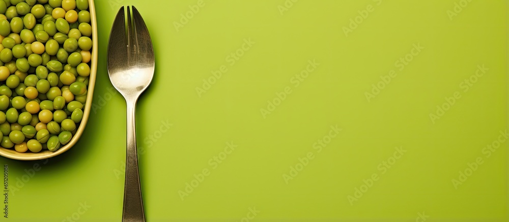 Poster fork background and green peas isolated pastel background copy space