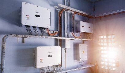 Instalation control of inverters solar panel on the wall. Technology of solar energy with shiny...