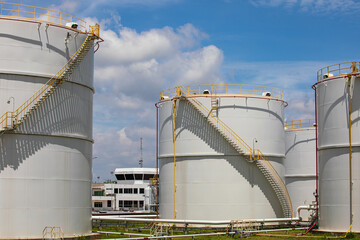 Tank farm in industry Thailand with white oil and petrol silos