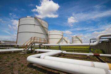 Tank farm in industry Thailand with white oil and petrol silos