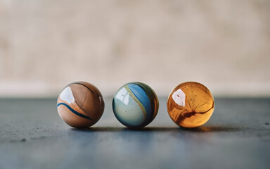 A minimalist arrangement of three colorful marbles.