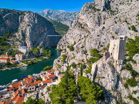 An aerial view of Mirabela fortress and Cetina River in Omis, Croatia