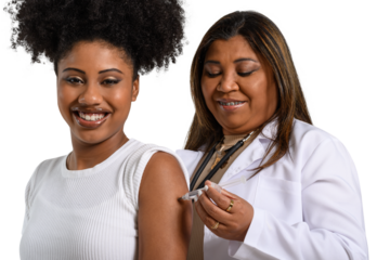 teenage girl being vaccinated in the arm looks at the camera and smiles, health professional vaccinating, 