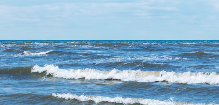 Calm ocean waves on a clear day sea and horizon image of sea waves and sky