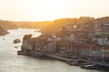 Beautiful colorful building facede in Porto Portugal next to Duero river in Ribeira in sunset - obrazy, fototapety, plakaty