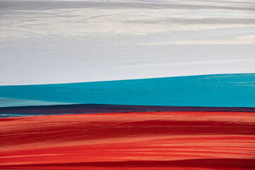 Fabric of flag of Russia. Details of canvas in three colors.