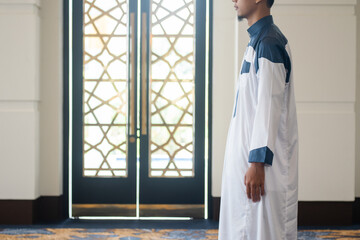 Asian muslim man solat and takbir take his hands up. Islam praying