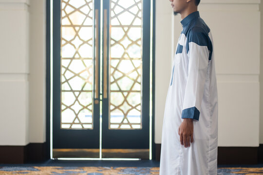 Asian muslim man solat and takbir take his hands up. Islam praying