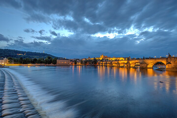 The famous Charles Bridge and the Hradcany in Prague at dusk
