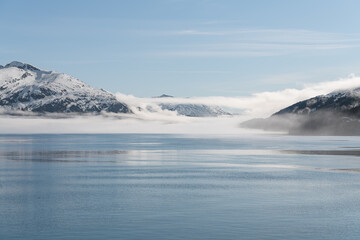 Fototapeta na wymiar Fog on the mountains and sea in Passage Canal, Whittier, Alaska USA