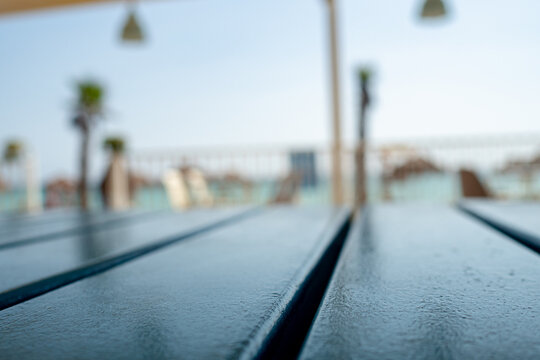blue table closeup with blurred vacation style summer background in one tropical restaurant