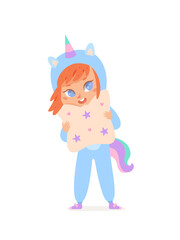 Cute girl in unicorn costume, happy kid in funny suit with horn and tail holding pillow