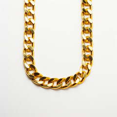 Obraz premium A golden neck chain on white background. Display of a golden chain product. Simple and elegant gold chain.