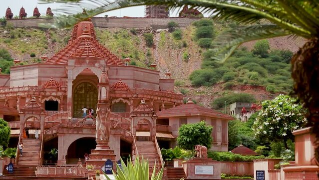 artistic red stone jain temple at morning from unique angle