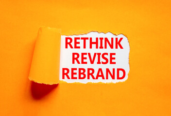 Rethink revise rebrand symbol. Concept word Rethink Revise Rebrand on beautiful white paper. Beautiful orange table background. Business brand motivational rethink revise rebrand concept. Copy space.