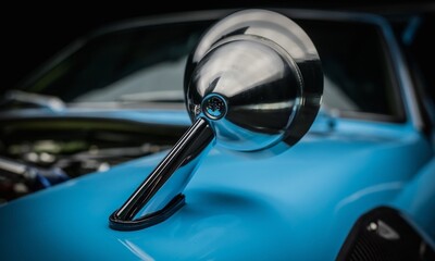 Fender mirror on a blue car