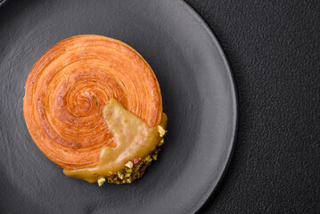 Round puff pastry croissant with raspberry filling or new york roll