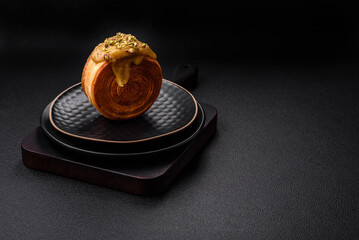 Round puff pastry croissant with raspberry filling or new york roll